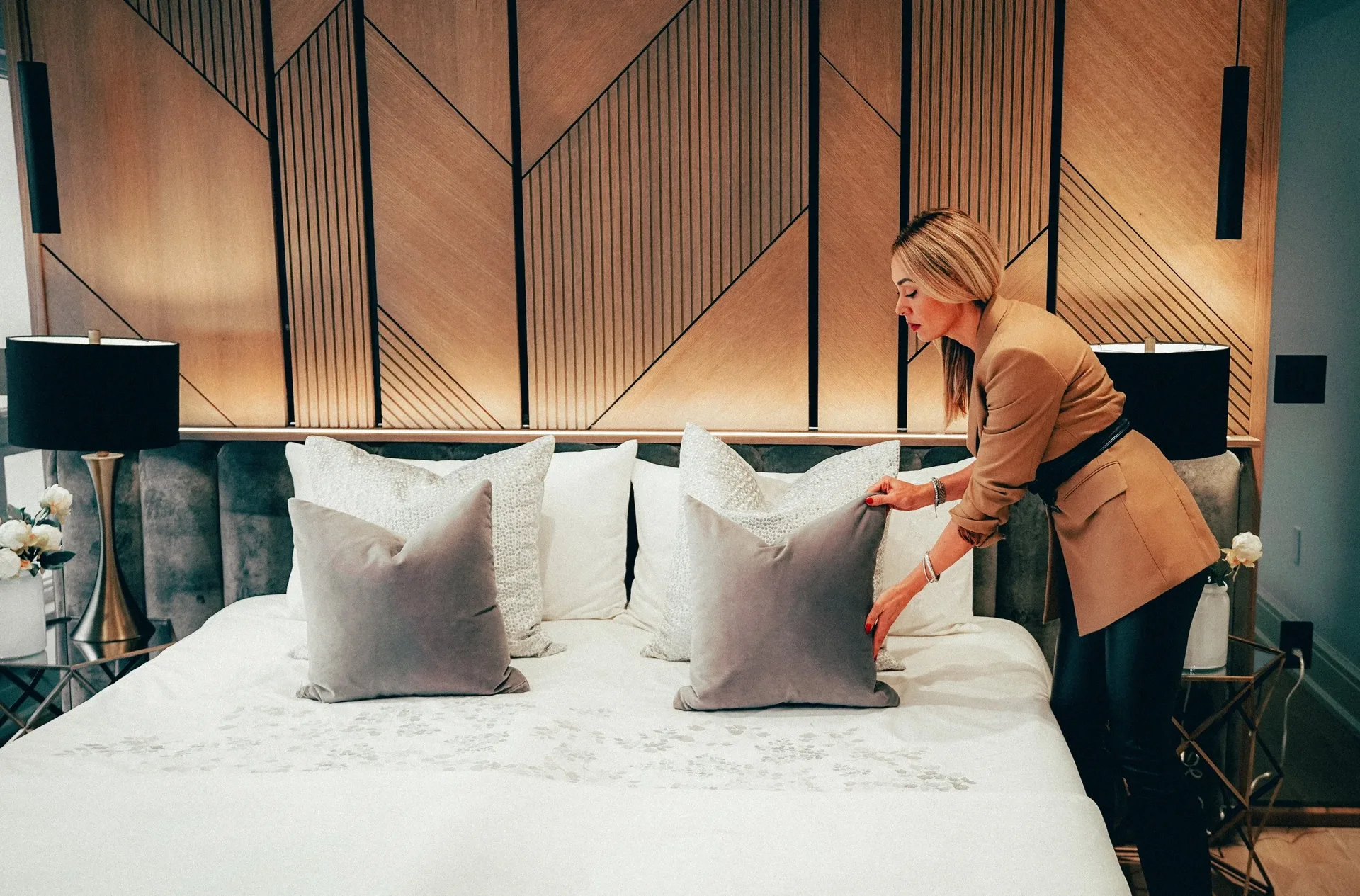 Bedroom styled by Sanaz Nouri with a wood panel feature wall